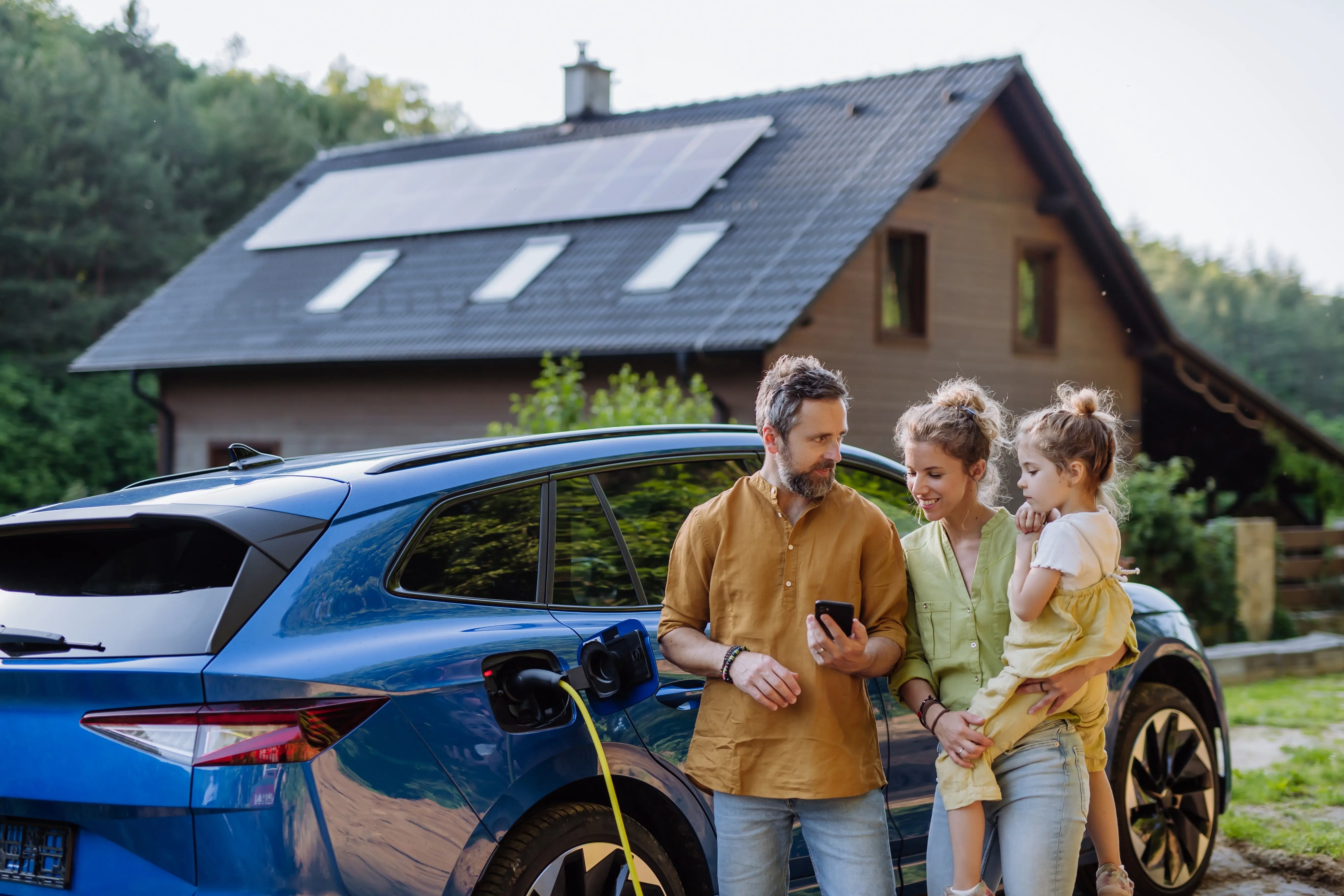 Family taking advantage of smart EV charging and solar integration