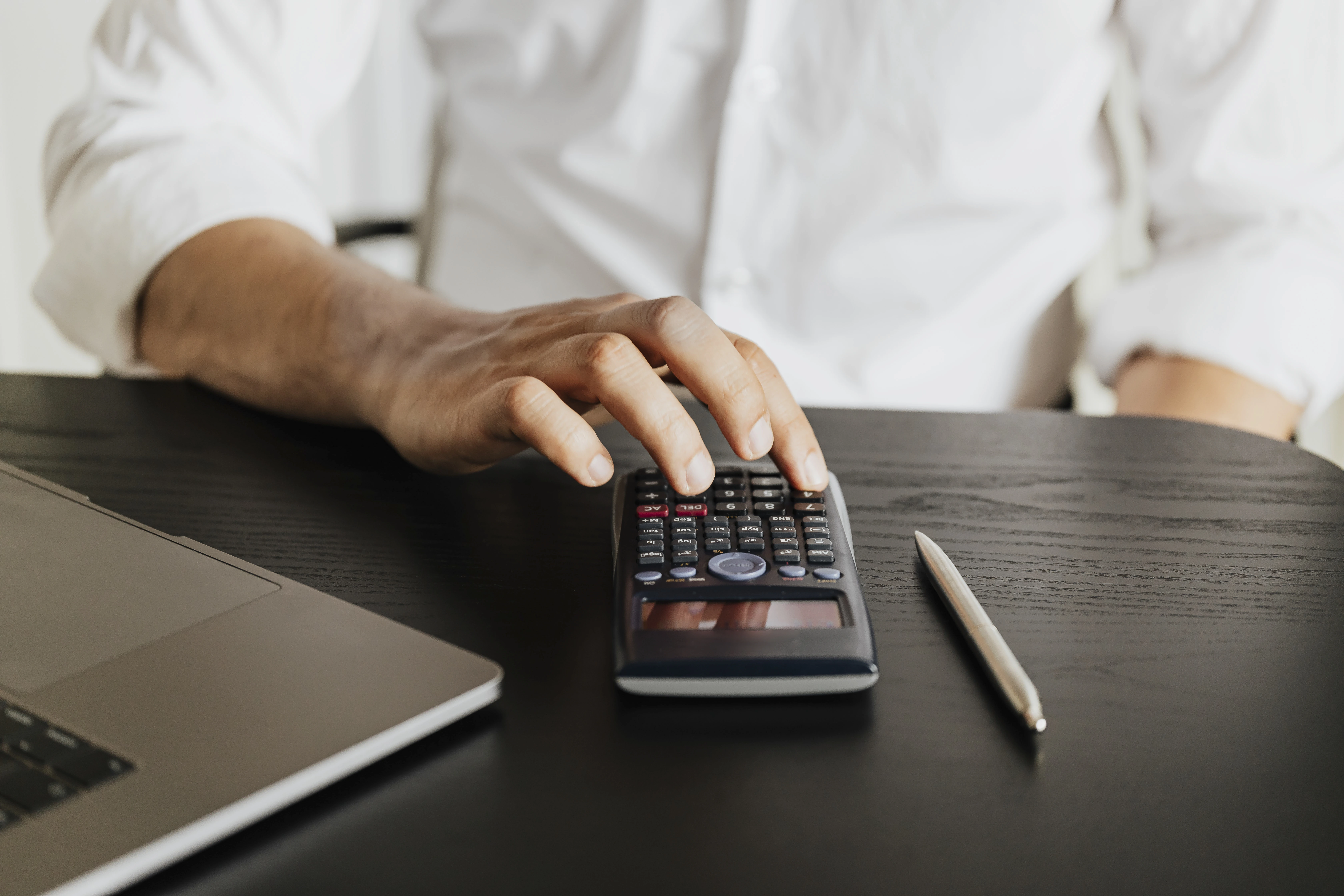 Man calculating the cost of solar panels after factoring in government schemes and financing options