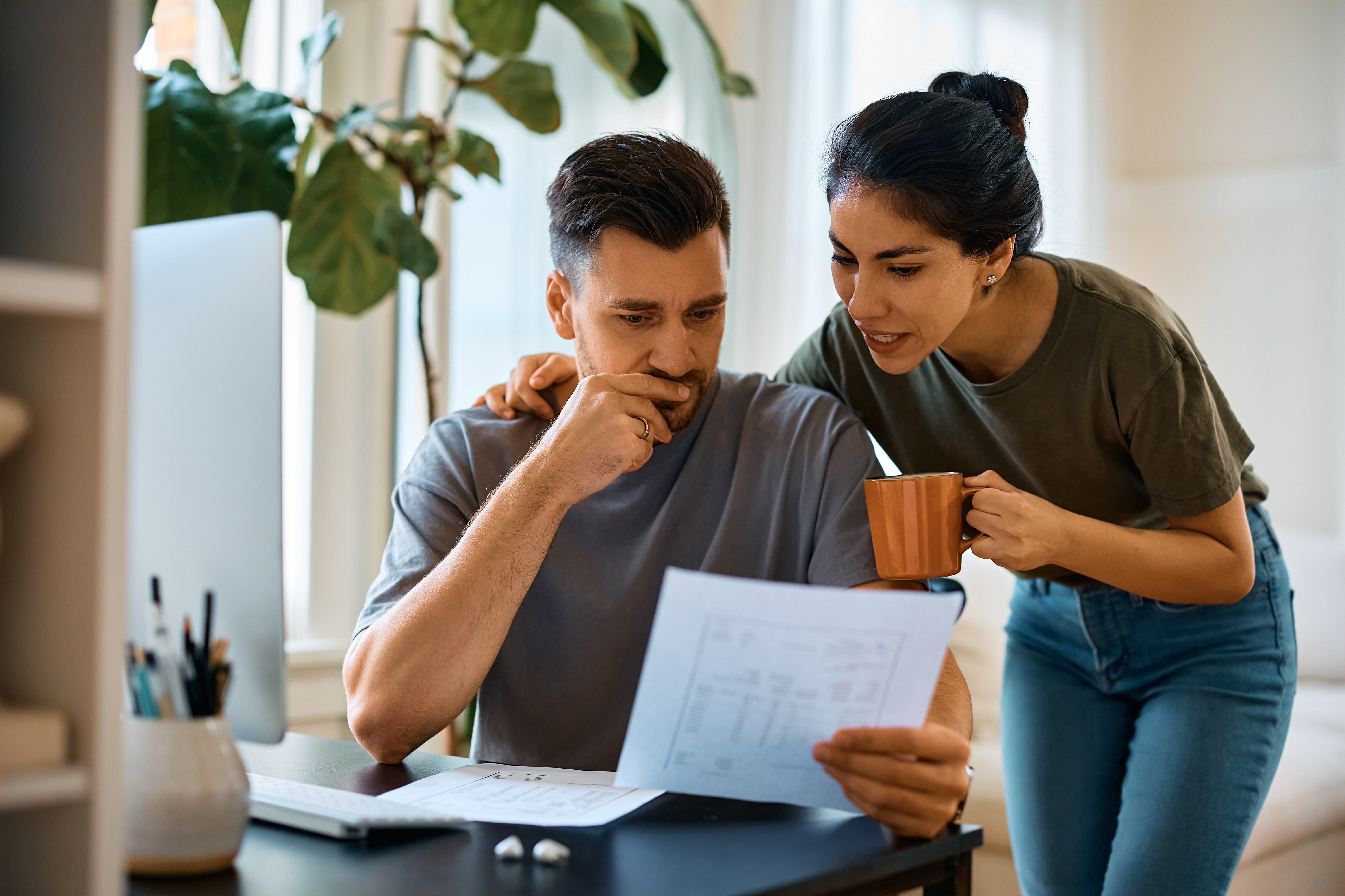 Couple looking at different energy tariffs.