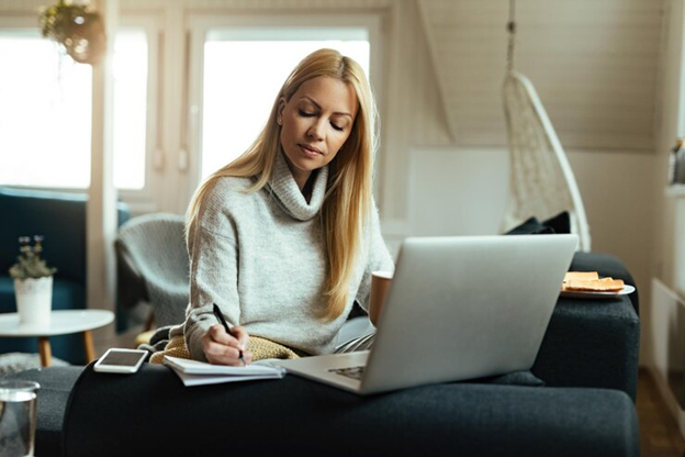Woman researching the right solar system for her Sussex home