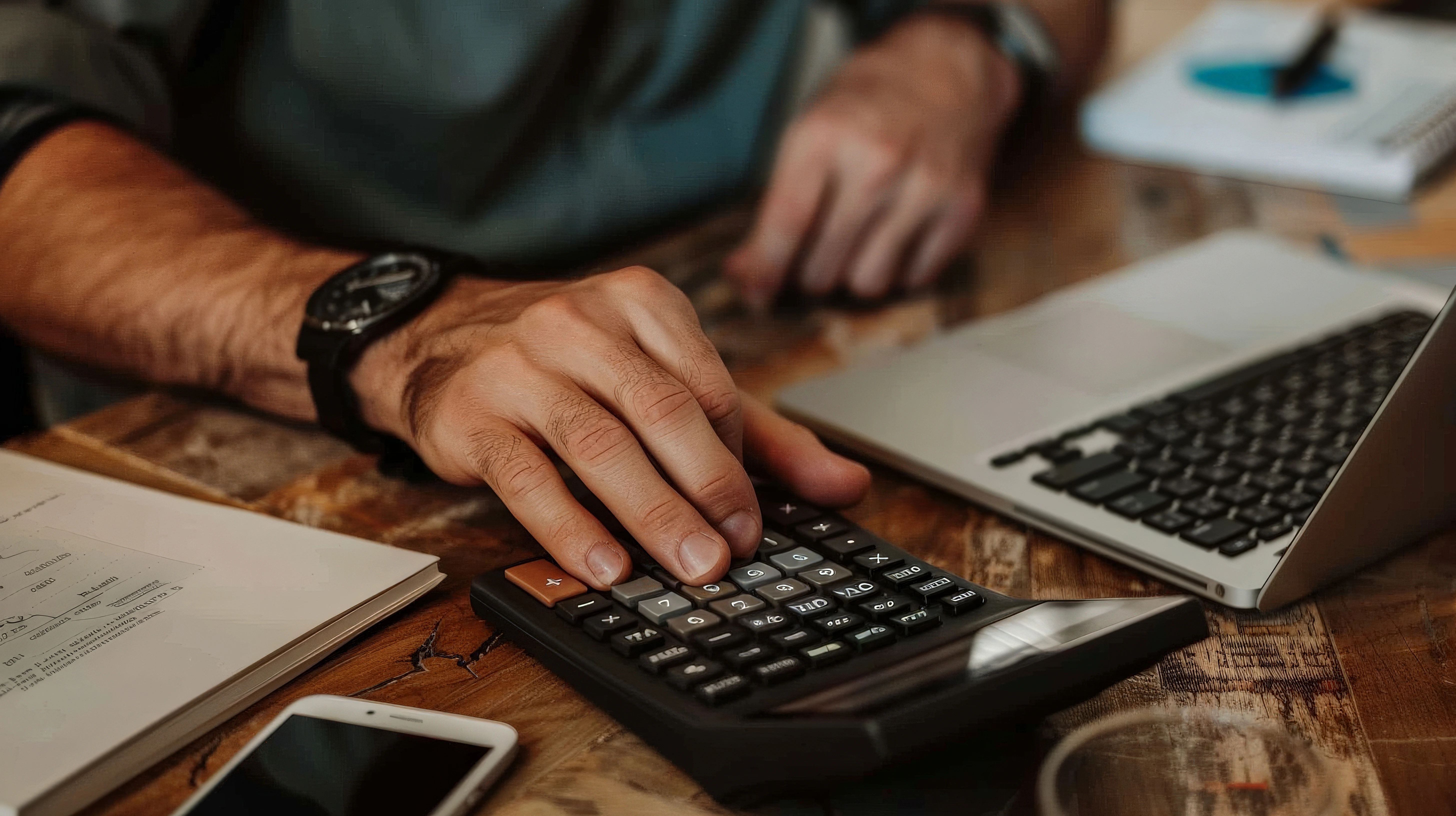 Man calculating the cost of a solar panel inverter replacement.