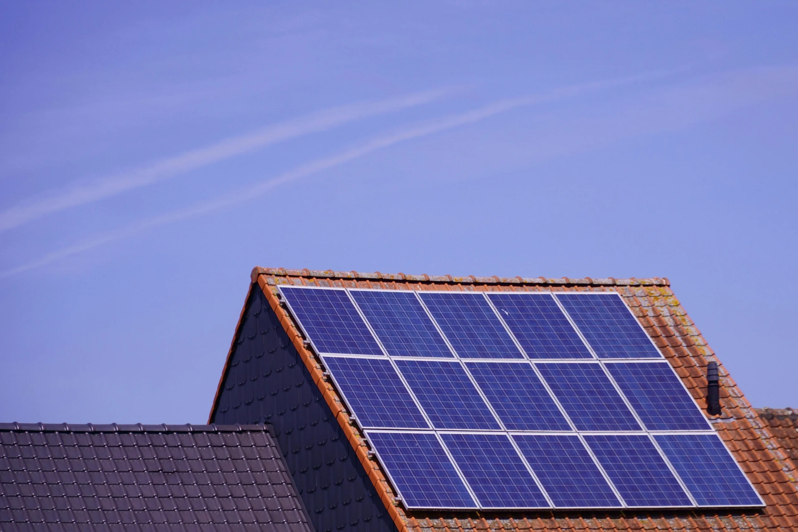 Solar panels installed on a Berkshire home roof, highlighting the benefits of renewable energy and lower energy costs.