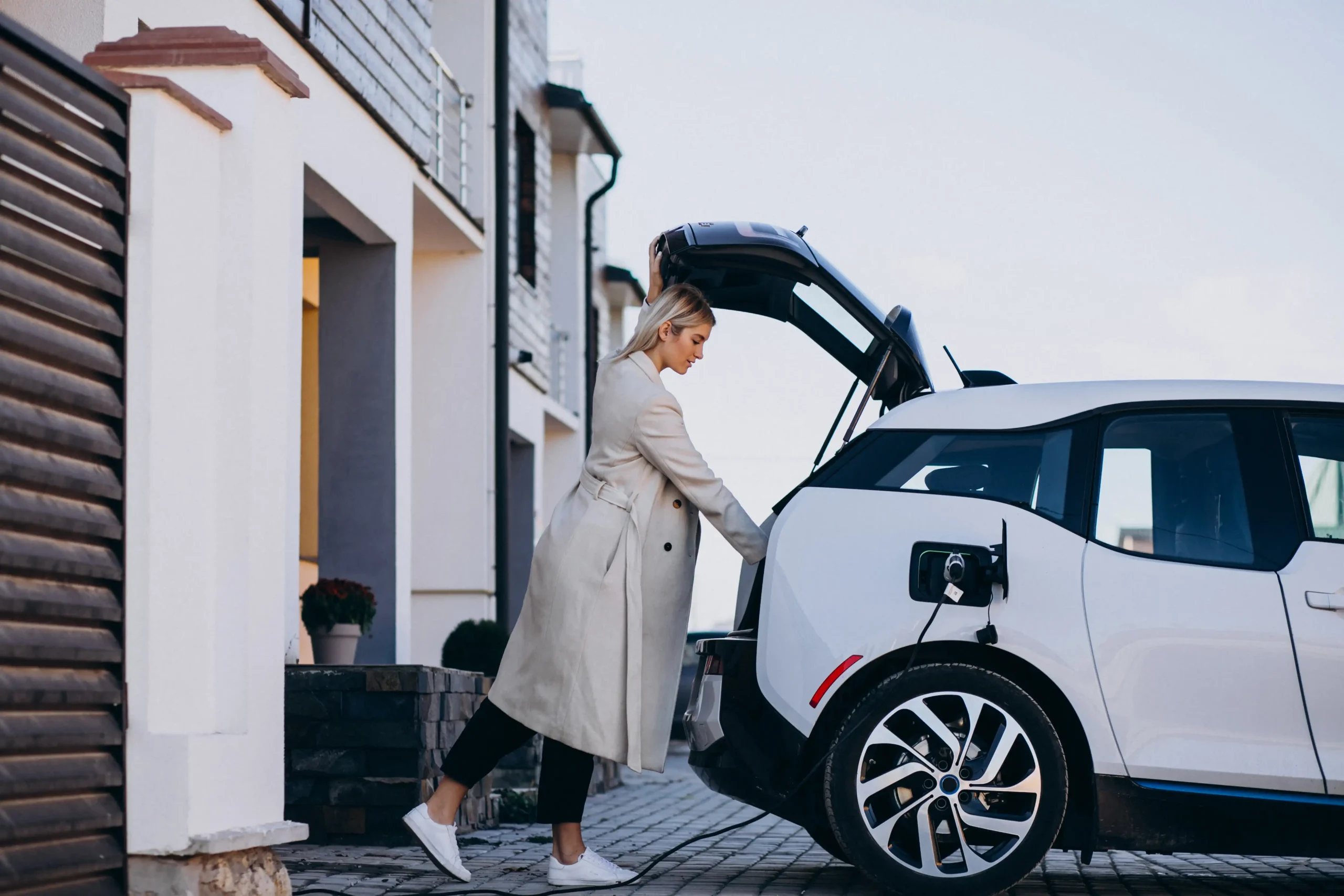Homeowner charging her electric car