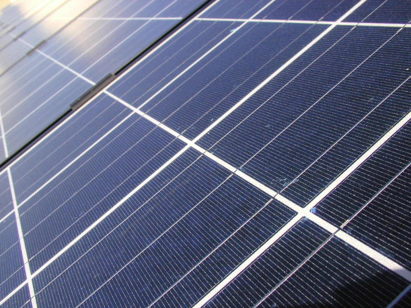 Close-up of solar panels generating electricity, supporting smart meter data insights for optimising solar usage.