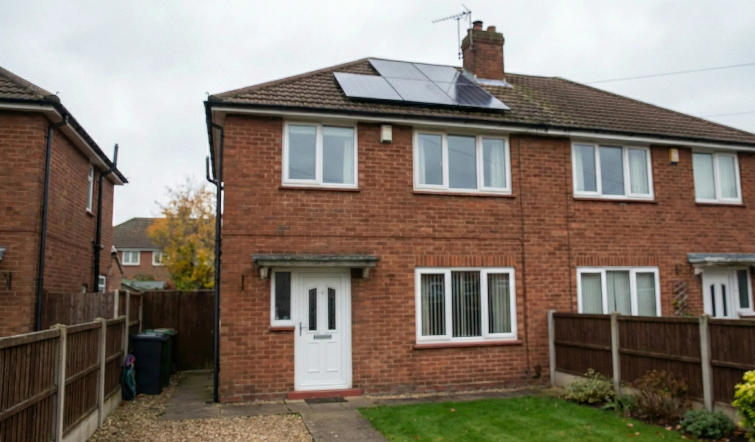 Residential UK property with solar panels highlighting the importance of heat retention for better solar efficiency.