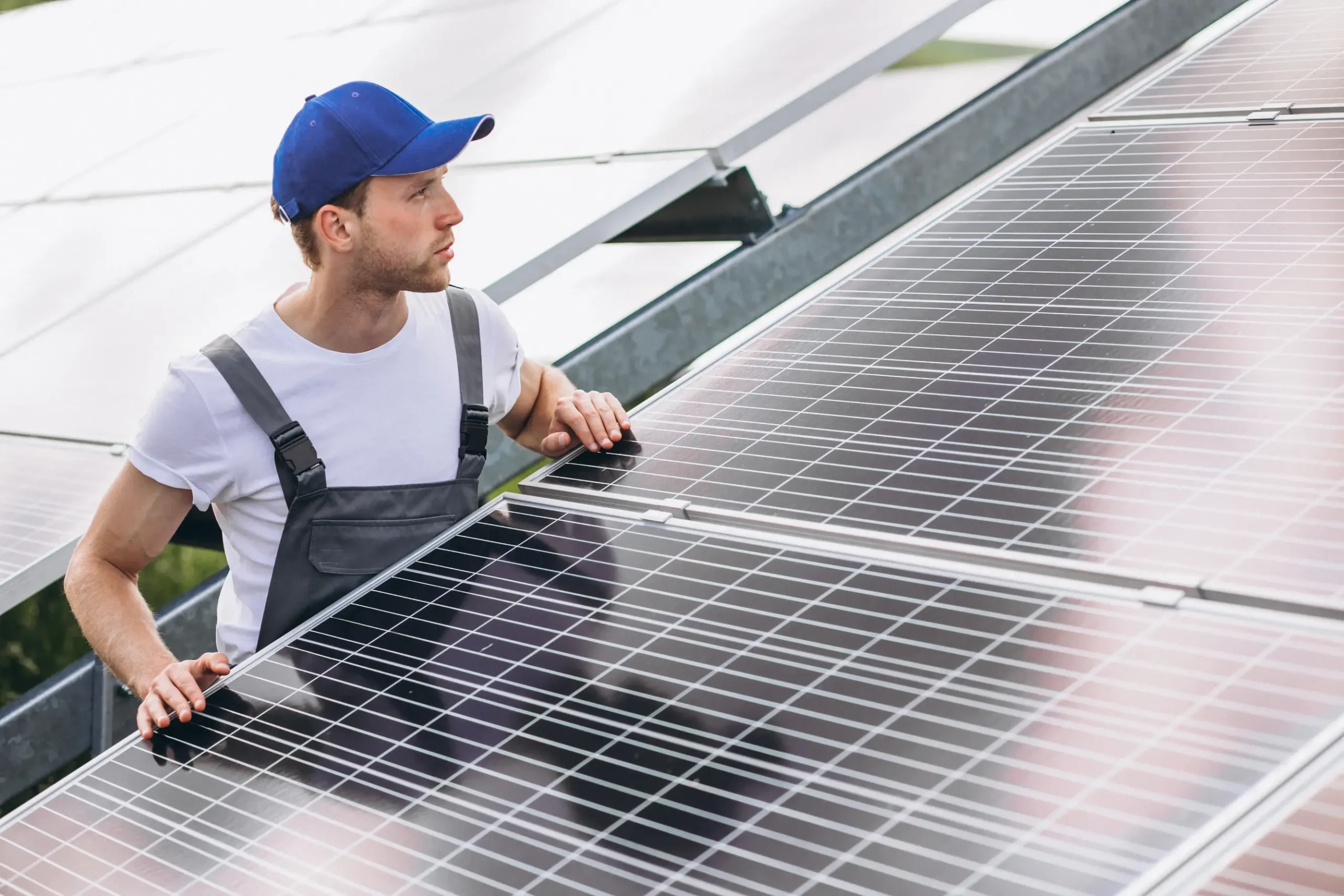 Solar installer repositioning rooftop solar panels, illustrating panel relocation, system moves, and when transferring solar panels is practical.
