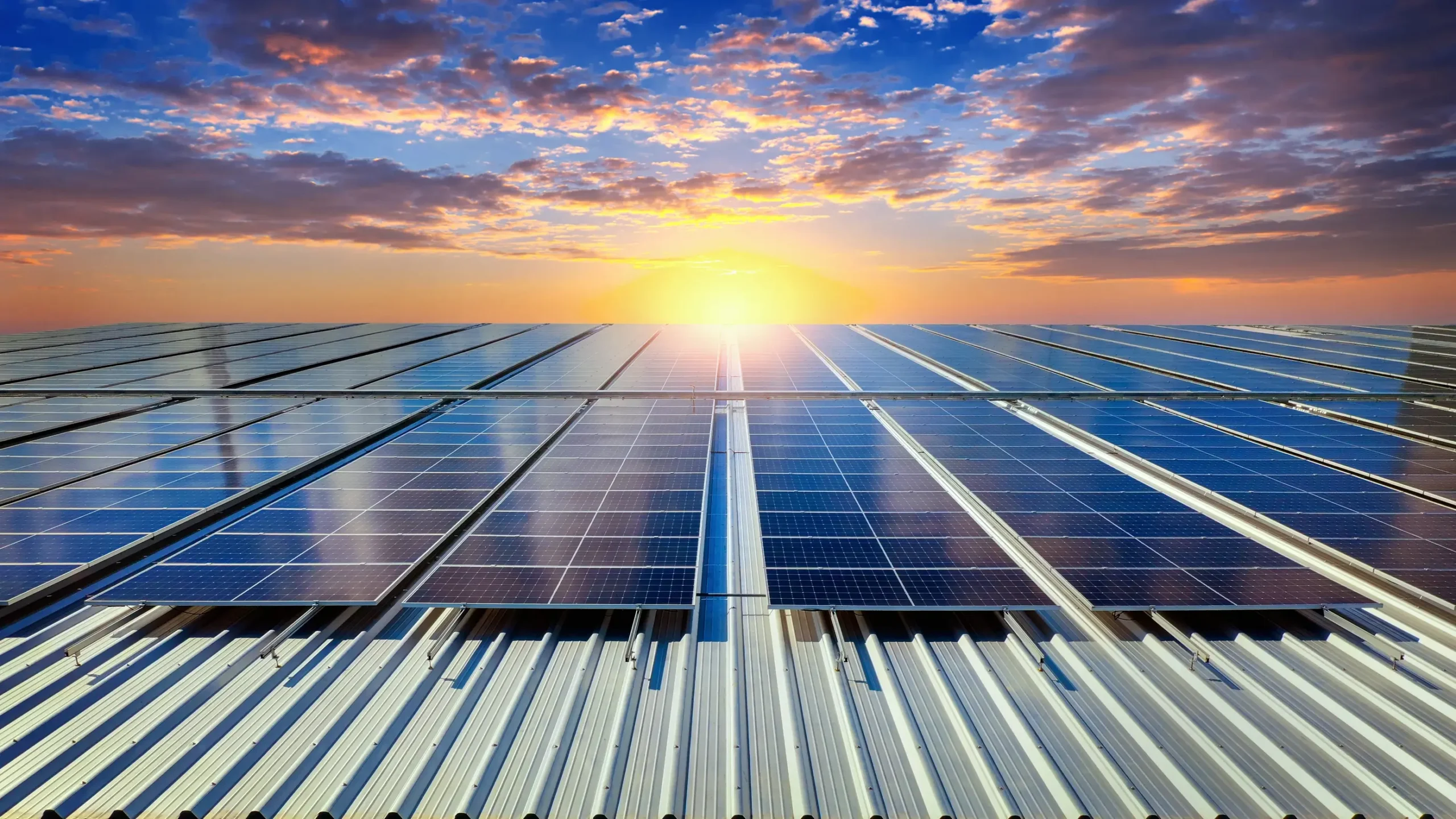 Rooftop solar panels generating electricity, illustrating energy production that can be used, stored, or exported for financial return.